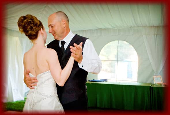 Beautiful Bride and her Proud Father having a wonderful time dancing their "Father Daughter Dance" at her wedding