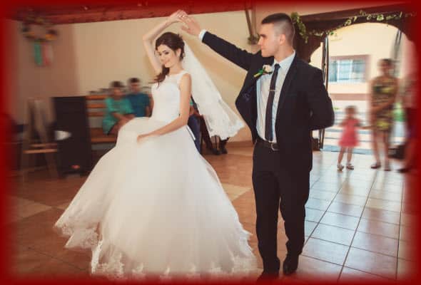 Newlywed Bride and Groom having fun dancing their "First Dance" at their wedding reception