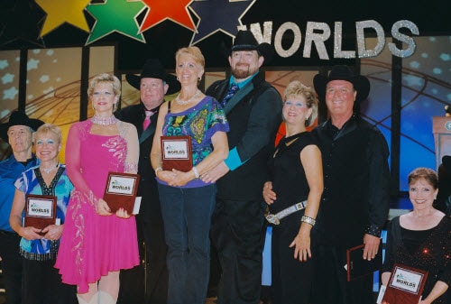 Tony New and Donna Whiteley on the award podium taking First Place Overall, brand new 2013 Couples World Champions in the Silver II Division, Nashville TN