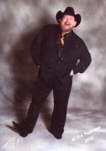 Tony New having fun being silly while taking his "award photo" for Line Dancing at the 2016 ACDA National Championships