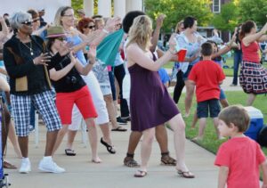 Line Dancers having fun line dancing in the Park