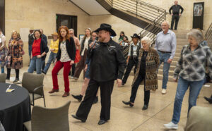 Second Thursdays Line Dancing at the Amon Carter - Tony New - Dance Instructor Guests at the Second Thursday event having a great time being taught Line Dancing by Tony New